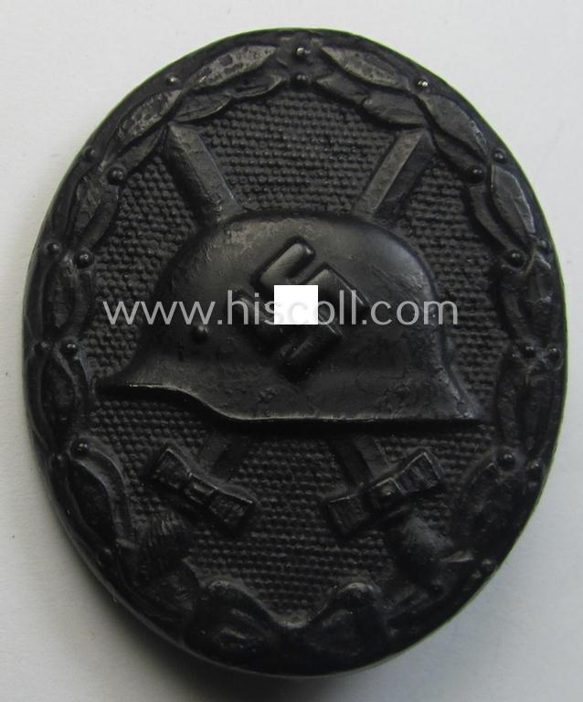 Black-class wound-badge (or: 'Verwundeten-Abzeichen in Schwarz') being a neatly maker- (ie. '65'-) marked example that was produced by the maker (ie. 'Hersteller') named: 'Klein & Quenzer'