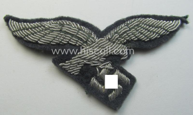 WH (Luftwaffe) officers'-pattern visor-cap-eagle (ie. 'Adler für LW-Offiziers-Schirmmütze') being a neatly hand-embroidered example of the: 'Extra Qualität' that comes in a 'virtually mint ie. unissued'-), condition