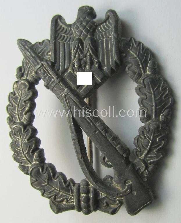 'Infanterie Sturmabzeichen in Silber' (or: silver infantry-assault badge ie. IAB) being a non-maker-marked (and 'hollow-back'-pattern) example as executed in zinc-based metal (ie. 'Feinzink') as was produced by the: 'Wilh. Deumer'-company