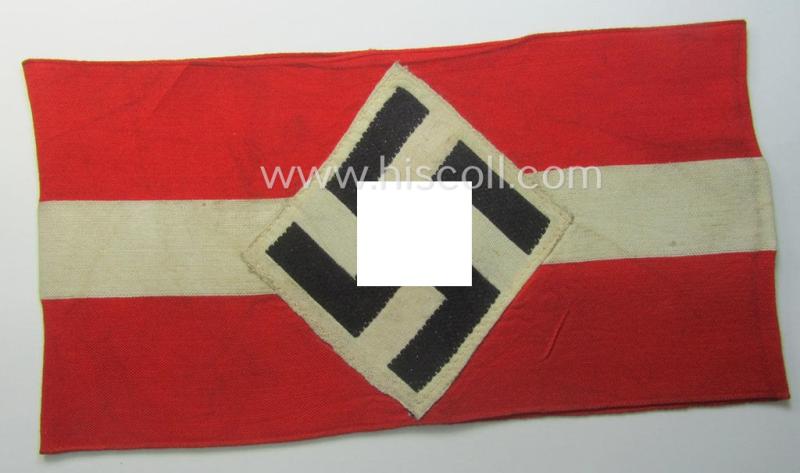 'Standard-issued'-pattern (ie. entirely woven) pattern, bright-red-coloured HJ- (ie. 'Hitlerjugend'-) related armband (ie. 'Armbinde') being a moderately worn- ie. used example that still retains its period 'RzM'-etiket