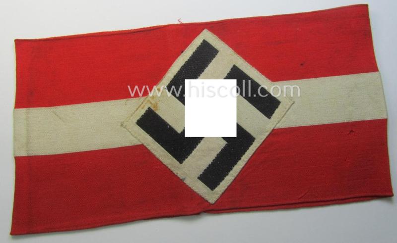 'Standard-issued'-pattern (ie. entirely woven) pattern, bright-red-coloured HJ- (ie. 'Hitlerjugend'-) related armband (ie. 'Armbinde') being a moderately worn- ie. used example that misses its 'RzM'-etiket