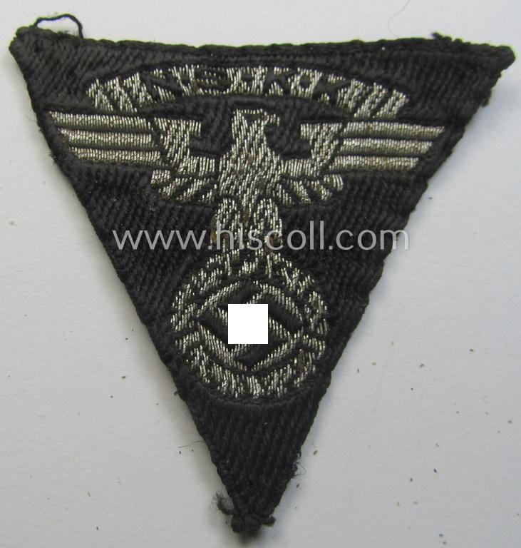 N.S.K.K. (ie. 'National Socialistisches Kraftfahr Korps') side-cap-eagle (ie. 'Adler für N.S.K.K.-Schiffchen o. Lagermütze') being a 'BeVo-woven'-example onto a black-coloured background