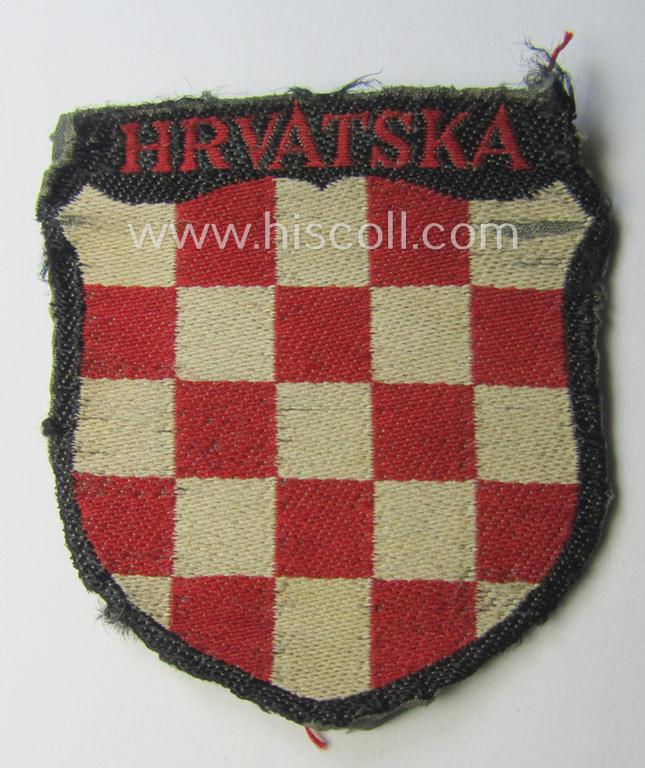 Truly used- and/or worn, multi-coloured- and/or 'BeVo'-woven armshield (ie. 'Ärmelschild') entitled: 'Hrvatska' as was intended for usage by a volunteer who served within the 'Deutsche Wehrmacht' ie. within the 'Kroatische Legion'