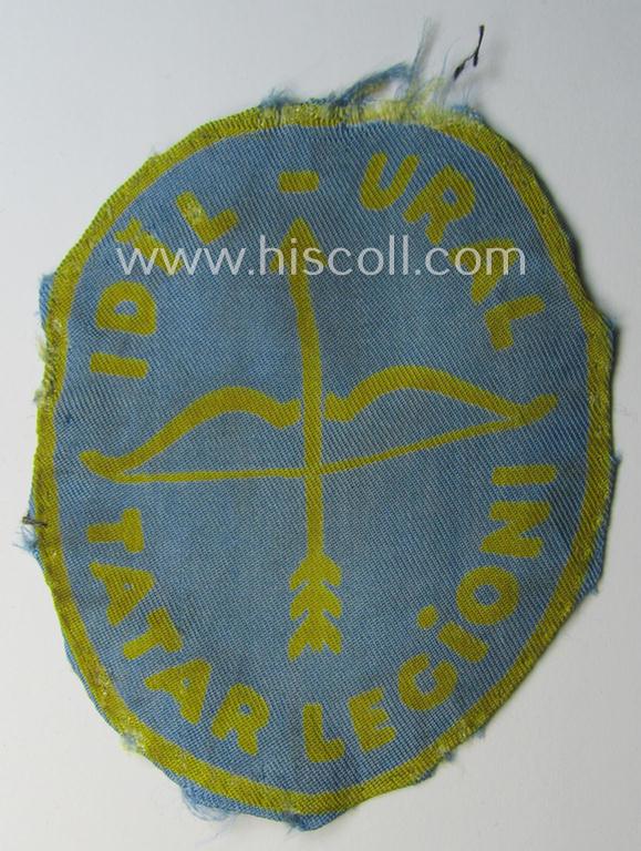 Truly used- and/or worn, 'printed'-pattern armshield (of the rarely encountered 3rd pattern!) entitled: 'Idil-Ural - Tatar Legioni' as was intended for a volunteer who served within the: 'Deutsche Wehrmacht' ie. within the: 'Volga-Tartar Legion'