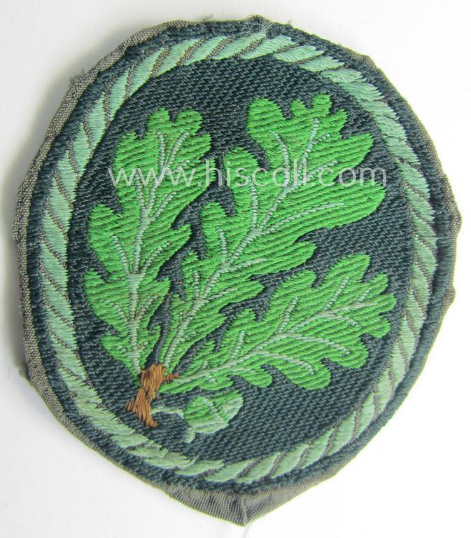 Truly used- and/or worn, WH (Heeres) EM- (ie. NCO-) type, so-called: 'Jäger'-armpatch being a (typical) 'BeVo'-woven example as was executed on field-grey-coloured linnen as was intended for usage by the: 'Jäger-Truppen'