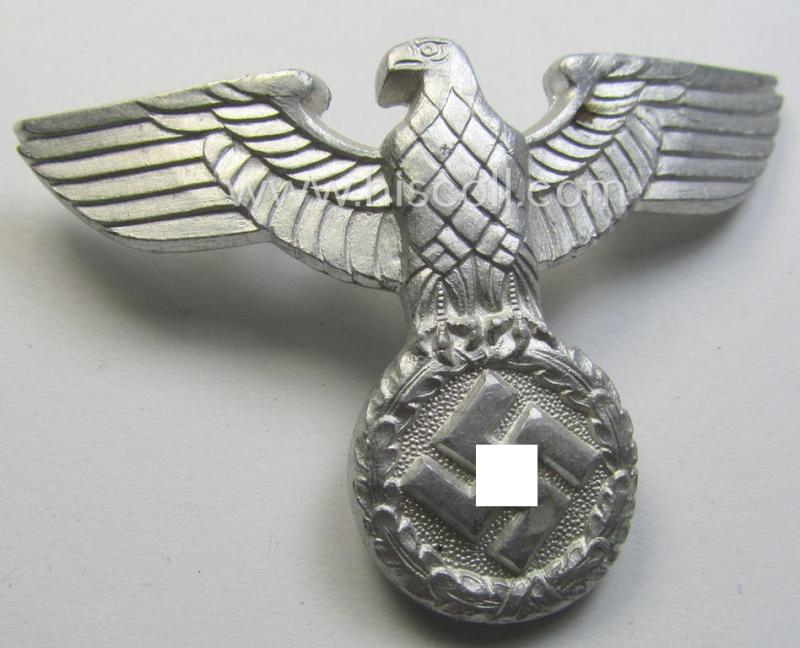Bright silverish-grey-coloured- and typical aluminium-based (political-style) visor- (ie. 'Schirmmützen'-) cap-eagle being a detailed example that is neatly: 'RzM - M1/111'-marked on its back
