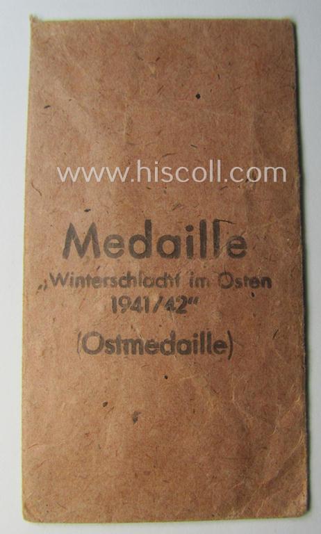 Empty 'Zellstoff'-based pouch as was intended for a medal: 'Winterschlacht im Osten 1941/42' as was produced by the: 'Eugen Schmidthaussler'-company (ie. 'Hersteller 28')