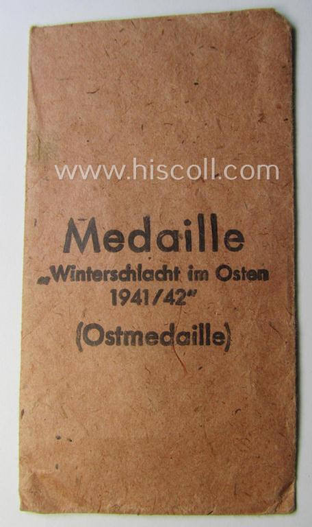 Empty 'Zellstoff'-based pouch as was intended for a medal: 'Winterschlacht im Osten 1941/42' as was produced by the company: 'Hauptmünzamt - Wien' (ie. 'Hersteller 30')