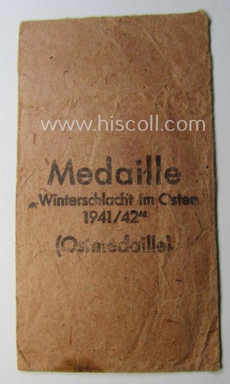 Empty 'Zellstoff'-based pouch as was intended for a medal: 'Winterschlacht im Osten 1941/42' as was produced by the: 'C.F. Zimmermann'-company (ie. 'Hersteller 20')