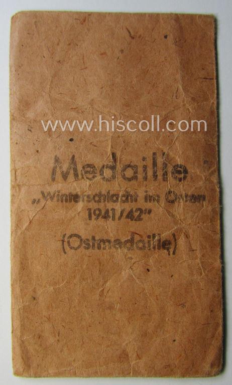 Empty 'Zellstoff'-based pouch as was intended for a medal: 'Winterschlacht im Osten 1941/42' as was produced by the company: 'B.H. Mayer's Kunstprägeanstalt' (ie. 'Hersteller 26')