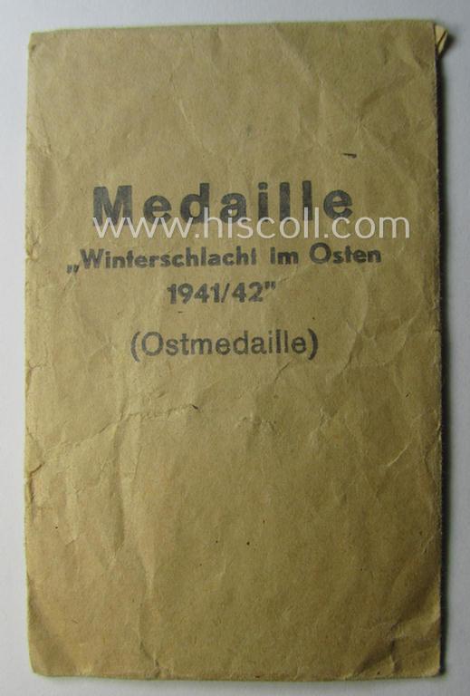 Empty 'variant'-pattern, 'Zellstoff'-based pouch as was intended for a medal: 'Winterschlacht im Osten 1941/42' as was produced by the company: 'Werner Redo' (ie. 'Hersteller 88')