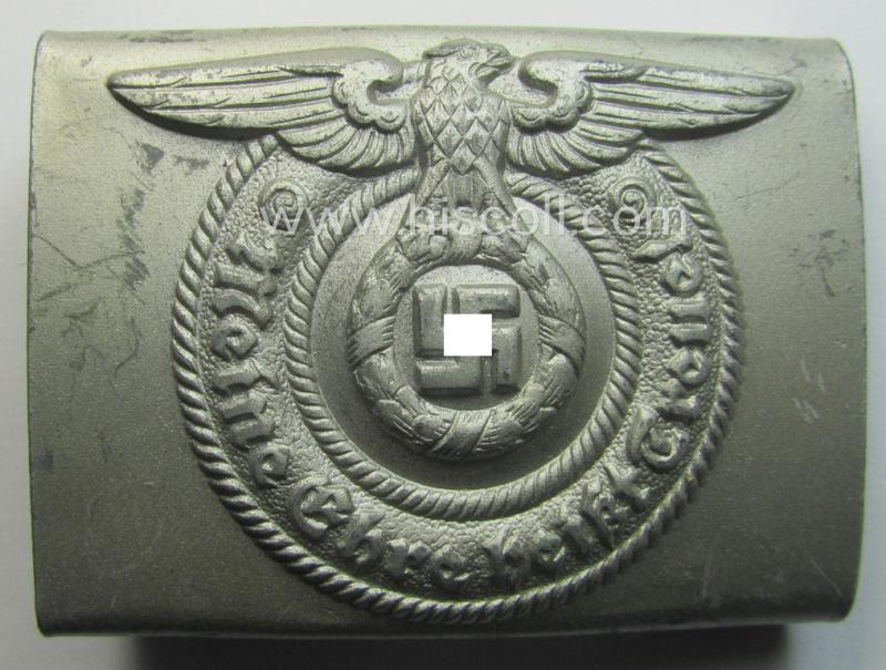 Hardly used- nor worn, example of a Waffen-SS enlisted-mens'- (ie. NCO-) type belt-buckle (being a typical, unmarked and typical steel-based: 'Overhoff & Cie'-example) that comes in a wonderful- and fully untouched-, condition
