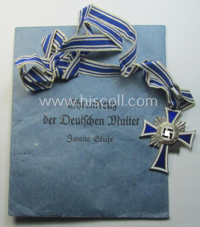 'Ehrenkreuz der deutschen Mutter - zweite Stufe' (or: silver-class mothers'-cross) that came mounted onto its long-sized ribbon and that came stored in its period pouch by the (unusual!) maker: 'Werner Redo - Saarlautern'