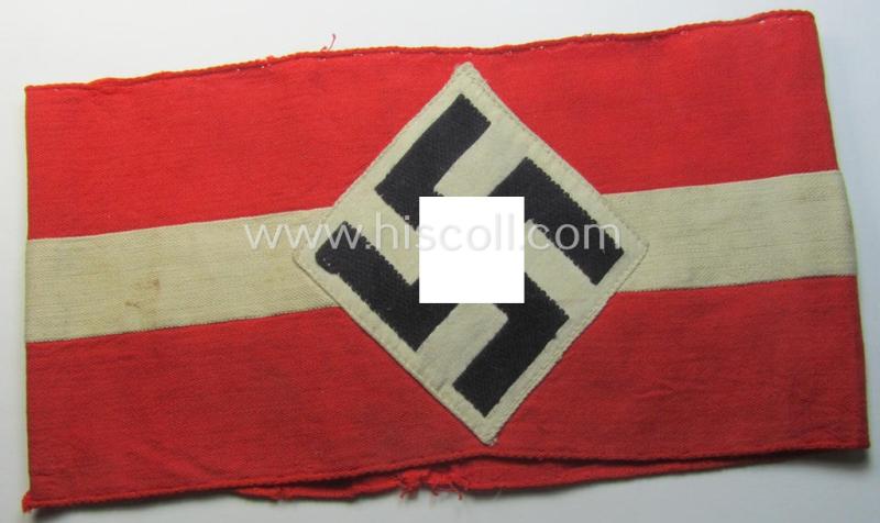 'Standard-issued'-pattern (ie. entirely woven) pattern, bright-red-coloured HJ- (ie. 'Hitlerjugend'-) related armband (ie. 'Armbinde') being a moderately worn- ie. used example that misses its 'RzM'-etiket