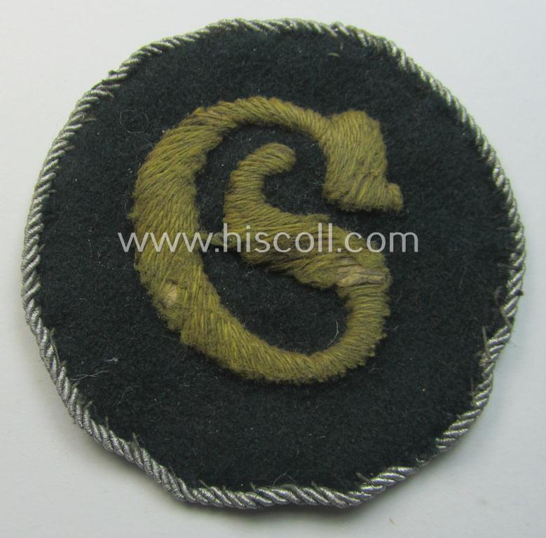 Truly used- and/or worn, WH (Heeres) machine-embroidered, trade- and/or special-career insignia (ie. 'Tätigkeitsabzeichen') as executed on a darker-green-coloured background as was intended for a: 'geprüfter Schirrmeister'