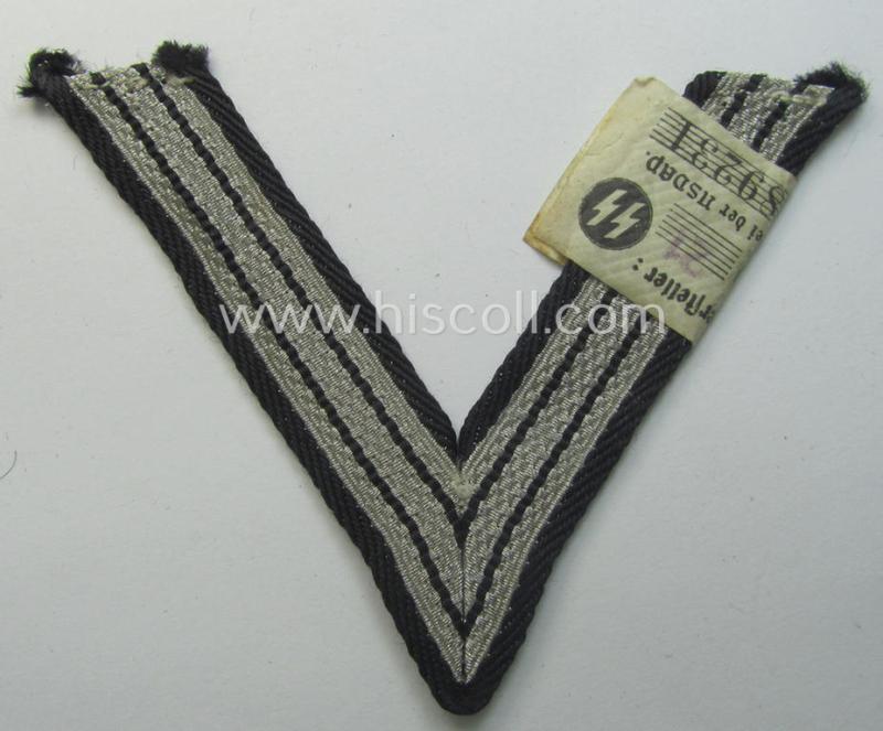 SS (ie. 'Allgemeine o. Waffen-SS') arm-insignia being an 'SS', so-called: 'Ehrenwinkel für Altgediente Kämpfer o. Angehörigen der SS' (or: honorary-chevron for old campaigners) still retaining its period 'RzM'-etiket