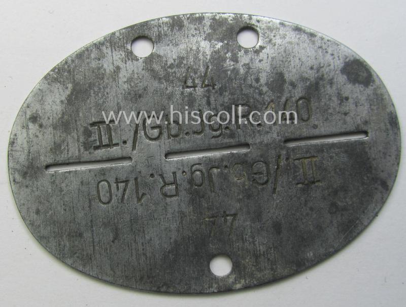 Zinc-based, WH (Heeres-) ie. 'Gebirgsjäger'-related ID-disc (ie. 'Erkennungsmarke') bearing the clearly stamped unit-designation that reads: 'II./Gb.Jg.R. 140' and that comes as issued and found