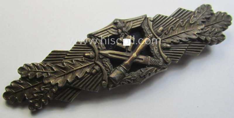 'Nahkampfspange in Bronze' (or: bronze-class close-combat clasp ie. CCC) being a maker- (ie. 'A.G.M.u.K.'-) marked- and/or minimal converse-shaped specimen having its period-attached (black-toned and steel-based) 'back-plate' in place