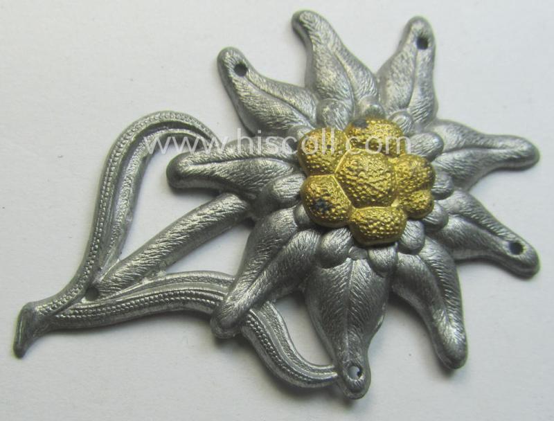 WH (Heeres) (bright) silverish-coloured, zinc-based (albeit non-maker-marked): 'M43'-pattern 'Edelweiss'-cap-badge (ie. 'Mützenabzeichen')