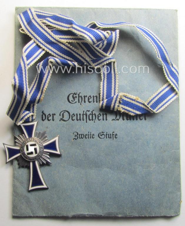'Ehrenkreuz der deutschen Mutter - zweite Stufe' (or: silver-class mothers'-cross) that came mounted onto its long-sized ribbon and that came stored in its period pouch by the maker: 'E. Ferd. Wiedmann - Frankfurt a. M.'