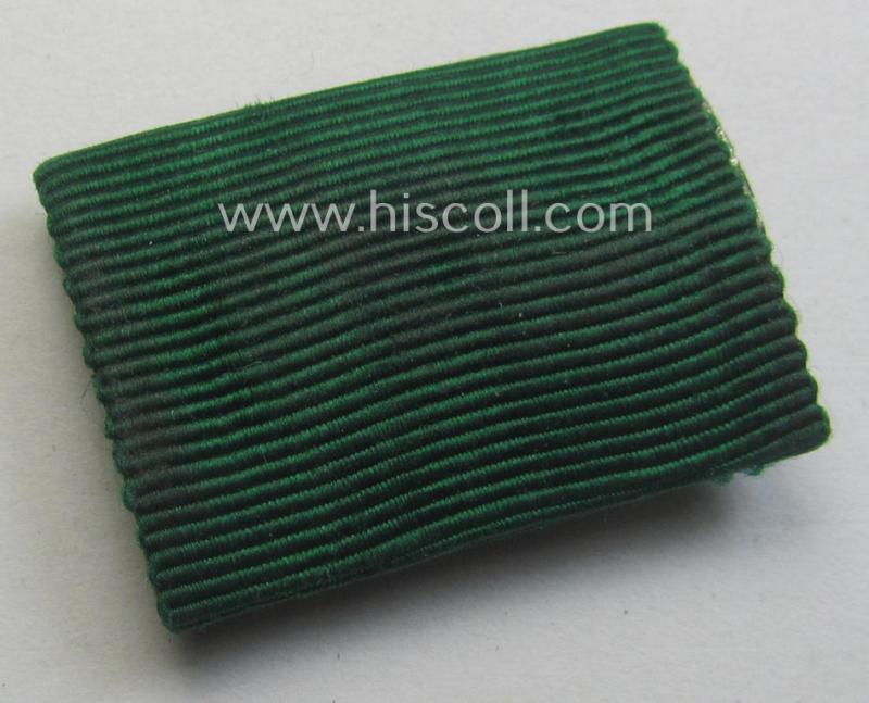 Single-pieced, ribbon-bar (ie. 'Band- o. Feldspange'): 'Tapferkeitsauszeichnung für Angehörige der Ostvölker, 3. Klasse in Bronze mit Schwn.'