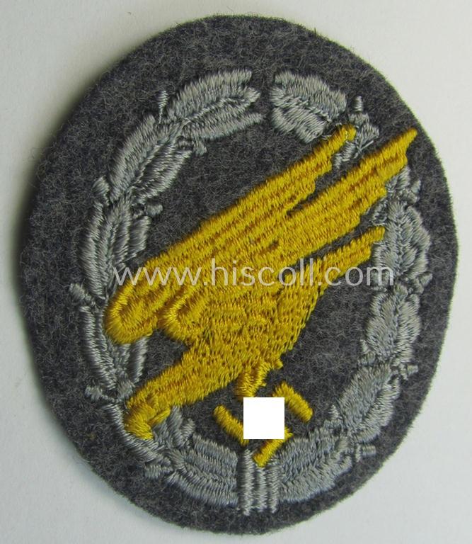 WH (LW) 'Fallschirmschützen-Abzeichen in Stoff' (or: cloth-based paratroopers'-jump-badge) being a nicely machine-embroidered specimen that comes in a probably issued albeit (I deem) never used- ie. 'virtually mint', condition
