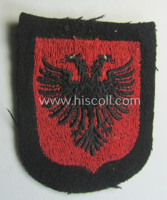 Waffen-SS 'volunteer'-arm-shield as was intended for usage by soldiers of the: '21. Waffen-Grenadier-Division der SS' “Skanderbeg” (ie. 'albanische Nr. 1') and that comes in a 'virtually mint- ie. unissued', condition