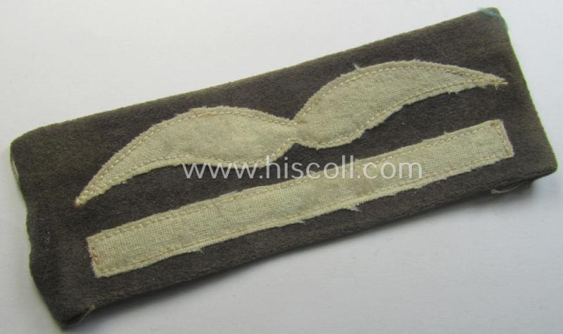 Moderately used- and/or tunic-removed, WH (LW) bluish-grey-coloured- and/or woolen-based, officers-pattern rank-patch (aka 'moustache'): 'Leutnant' (ie. lieutnant)