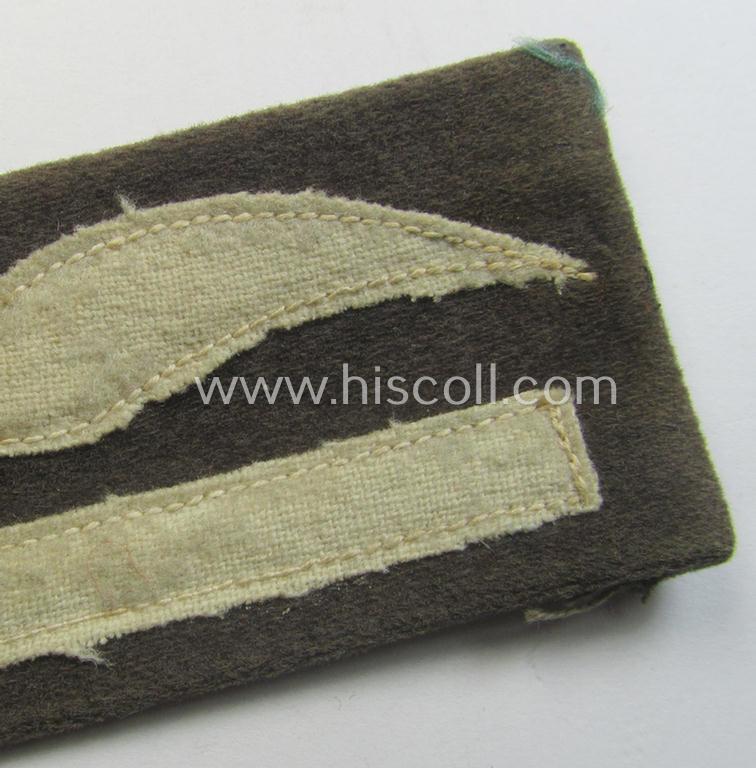 Moderately used- and/or tunic-removed, WH (LW) bluish-grey-coloured- and/or woolen-based, officers-pattern rank-patch (aka 'moustache'): 'Leutnant' (ie. lieutnant)