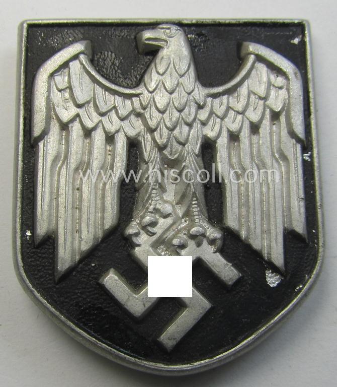 WH (Heeres) tropical- (ie. 'DAK'- or: 'Deutsches Afrikakorps'-) related- and/or aluminium-based, eagle-'pith-helmet'-shield being a maker- (ie. 'A'-) marked example that comes in a very nice- (ie. hardly used-), condition