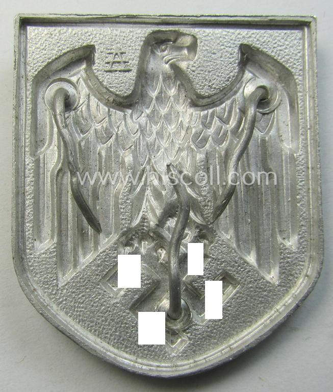 WH (Heeres) tropical- (ie. 'DAK'- or: 'Deutsches Afrikakorps'-) related- and/or aluminium-based, eagle-'pith-helmet'-shield being a maker- (ie. 'A'-) marked example that comes in a very nice- (ie. hardly used-), condition