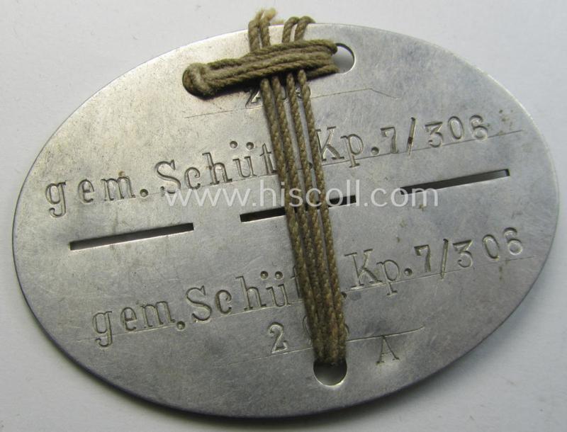 WH (Heeres) ie. 'Infanterie'-related ID-disc: 'gem.Schütz.Kp.7/306' that comes mounted onto its period cord