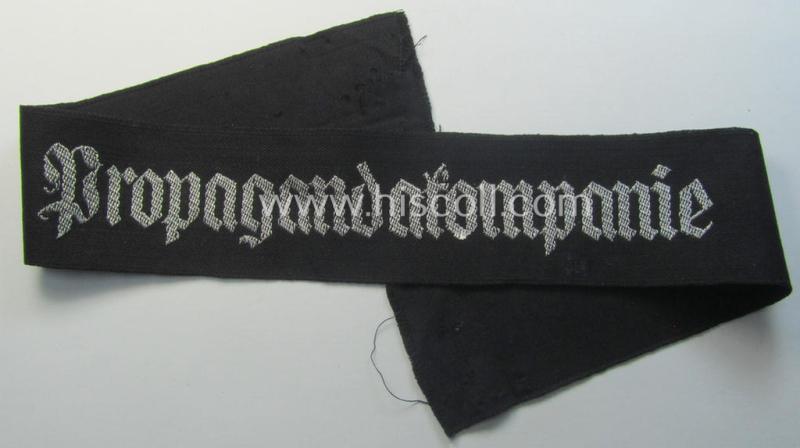 WH (Heeres) related cuff-title (ie. 'Ärmelstreifen') being a typical black-coloured- and linnen-based example showing the (neatly silver-toned- and 'flatwire'-woven!) text that reads: 'Propagandakompanie'