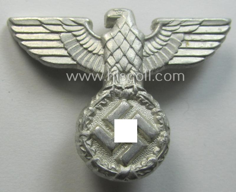 Smaller-sized, bright silverish-grey-coloured- and typical aluminium-based (political-style) visor- (ie. 'Schirmmützen'-) cap-eagle being a detailed example that is neatly: 'RzM - M1/17'-marked on its back