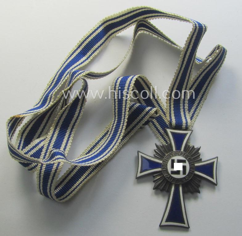 'Ehrenkreuz der deutschen Mutter - zweite Stufe' (or: silver-class mothers'-cross) that came mounted onto its long-sized ribbon as issued and recently found