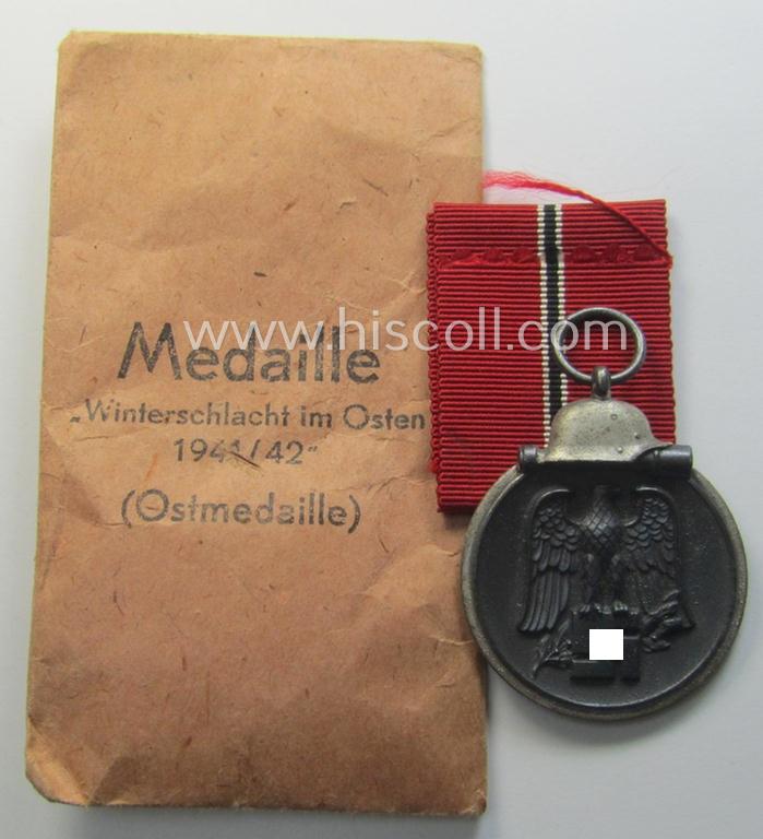 Neatly maker- (ie. '110'-) marked medal: 'Winterschlacht im Osten 1941/42' in its period pouch by the company: 'Otto Zappe'