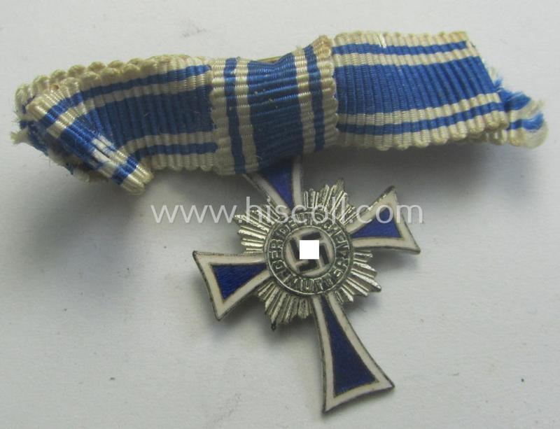 Miniature of an: 'Ehrenkreuz der deutschen Mutter - zweite Stufe' (or: silver-class mothers'-cross) being a non-maker-marked example that comes in an overall nice- (albeit moderately worn- ie. used-), condition