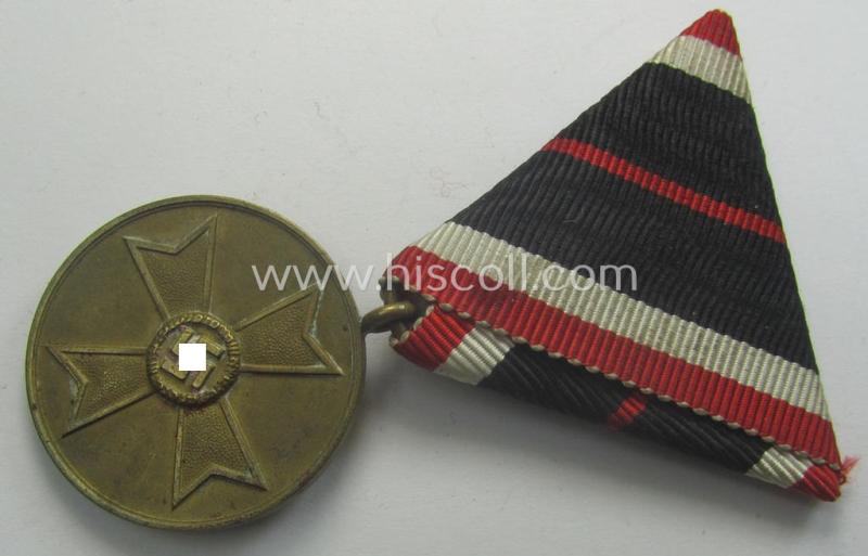 Medal-set: 'Kriegsverdienstmedaille 1939' being a (typical) non-maker-marked- (and 'Buntmetall'-based) specimen that came mounted onto its (scarcely seen!) bright-red-coloured- and/or Austrian-styled ribbon (ie. 'Bandabschnitt')
