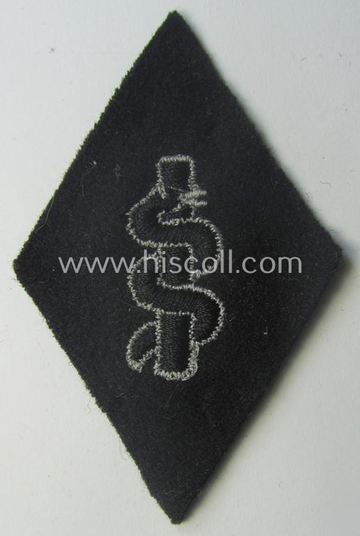 Waffen-SS-pattern, machine-embroidered and/or black- and white-coloured sleeve-insignia (ie. 'Ärmelraute') depicting a so-called: 'Aesculapus'-sign as was used and intended to signify membership within the 'SS-Sanitätsdienst'
