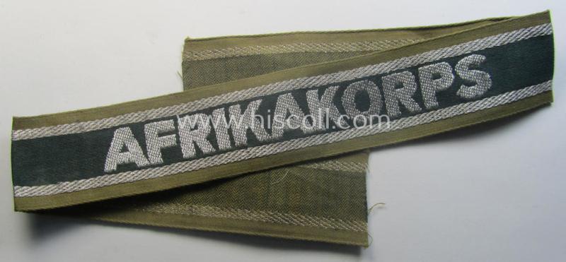 'BeVo'-like cuff-title (ie. 'Ärmelstreifen') entitled: 'Afrikakorps' being a presumably issued but simply never worn example that comes in an overall very nice- (ie. non-shortened- and never tunic-attached-), condition