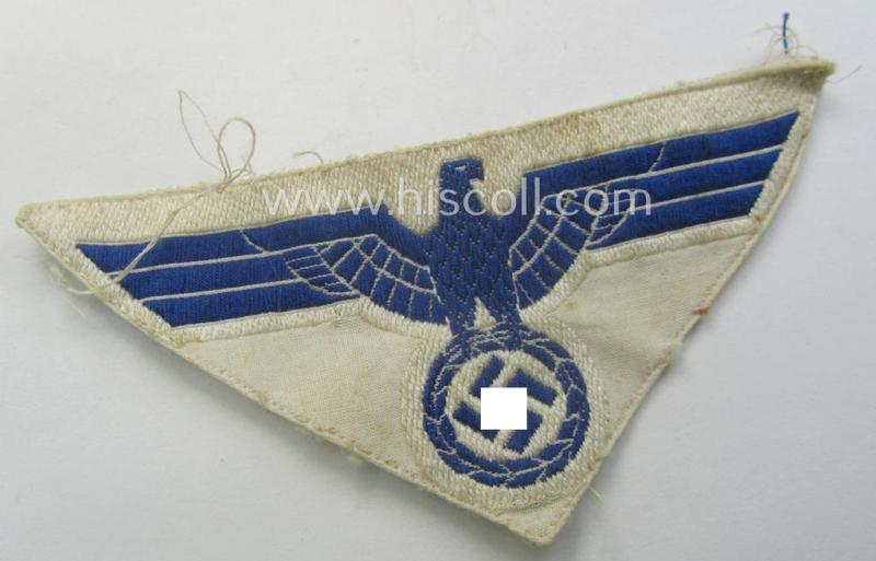 Truly used- and/or tunic-removed, WH (KM) related breast-eagle (ie. 'Brustadler für Mannschaften u. Uffz. der Kriegsmarine') being a 'standard-issue'-pattern-example as executed in the 'BeVo'-weave-pattern on a white-coloured background