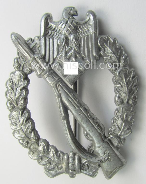 'Infanterie Sturmabzeichen in Silber' being a (typical) non-maker-marked and/or quite converse, 'solid-back' example as was executed in greyish-silver-coloured, zinc-based metal by the maker: 'Frank & Reif'