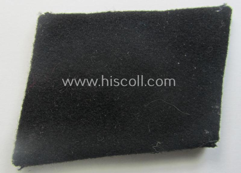Waffen-SS EM-pattern rank-collar-rank-tab ('Kragenspiegel') being a 'standard-issue'-pattern example as executed in black-coloured wool as was intended for usage by an: 'SS-Mann'