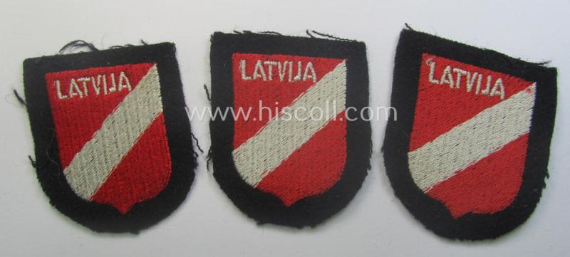 Latvian, Waffen-SS 'volunteer' arm-shield as was specifically intended for usage by soldiers of the: '15. o. 19. Waffen-Grenadier-Division der SS' (ie. 'lettische nr. 1 o. 2') that comes in a 'virtually mint- ie. unissued', condition