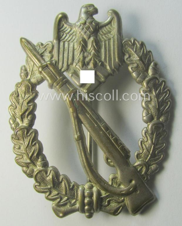 'Infanterie Sturmabzeichen in Silber' (or: silver-class infantry-assault-badge ie. IAB) being a 'Buntmetall'-based example by the: 'Otto Schickle'-company