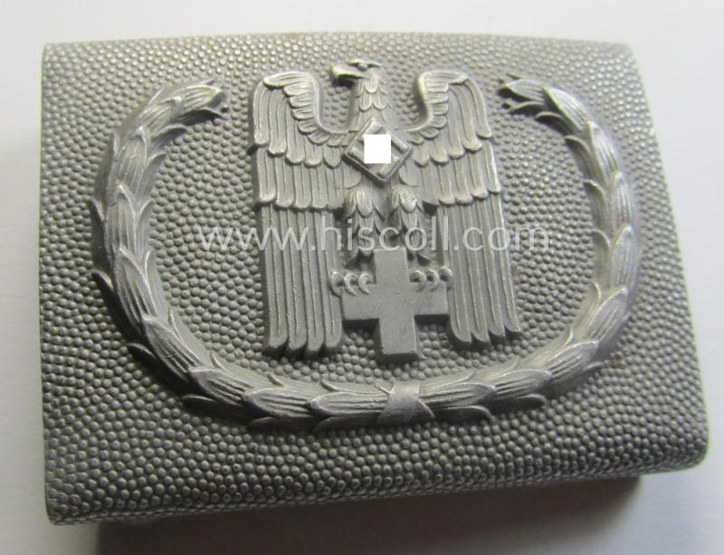 Aluminium-based, so-called: DRK (ie. 'Deutsches Rotes Kreuz'), enlisted-mens'- (ie. NCO-) type belt-buckle being a clearly maker- (ie. 'Ges.Gesch. 1'-) marked example