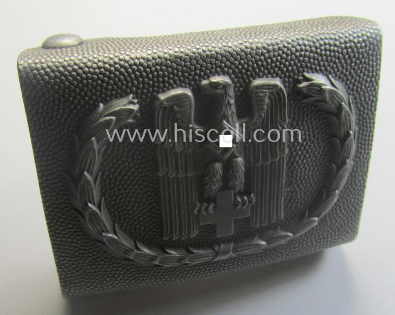 Aluminium-based, so-called: DRK (ie. 'Deutsches Rotes Kreuz'), enlisted-mens'- (ie. NCO-) type belt-buckle being a clearly maker- (ie. 'Ges.Gesch. 1'-) marked example