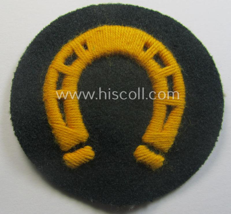 WH (Heeres) so-called: trade- and/or special-career arm-insignia (ie. 'Laufbahn- o. Tätigkeitsabzeichen') as was specifically intended for an army: 'Hufbeschlagmeister' (or farrier) being a neatly hand-embroidered variant on darker-green-coloured wool