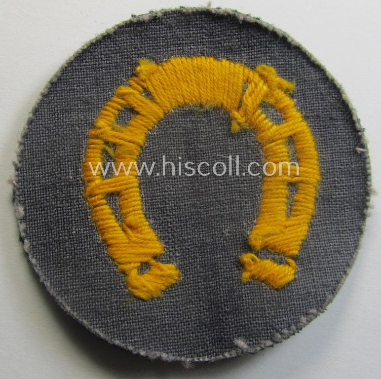 WH (Heeres) so-called: trade- and/or special-career arm-insignia (ie. 'Laufbahn- o. Tätigkeitsabzeichen') as was specifically intended for an army: 'Hufbeschlagmeister' (or farrier) being a neatly hand-embroidered variant on darker-green-coloured wool