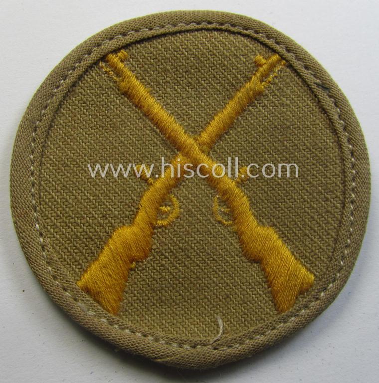 WH (Heeres) 'tropical'-issue, trade- and/or special-career insignia (ie. machine-embroidered 'Laufbahn- o. Tätigkeitsabzeichen') as was intended for an army: 'Waffenmeister' (or weapon-equipment NCO)